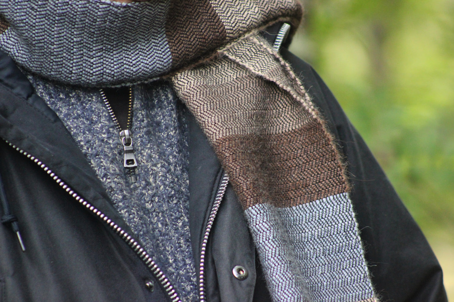 Blue, beige and brown alpaca and cotton herringbone scarf close up.