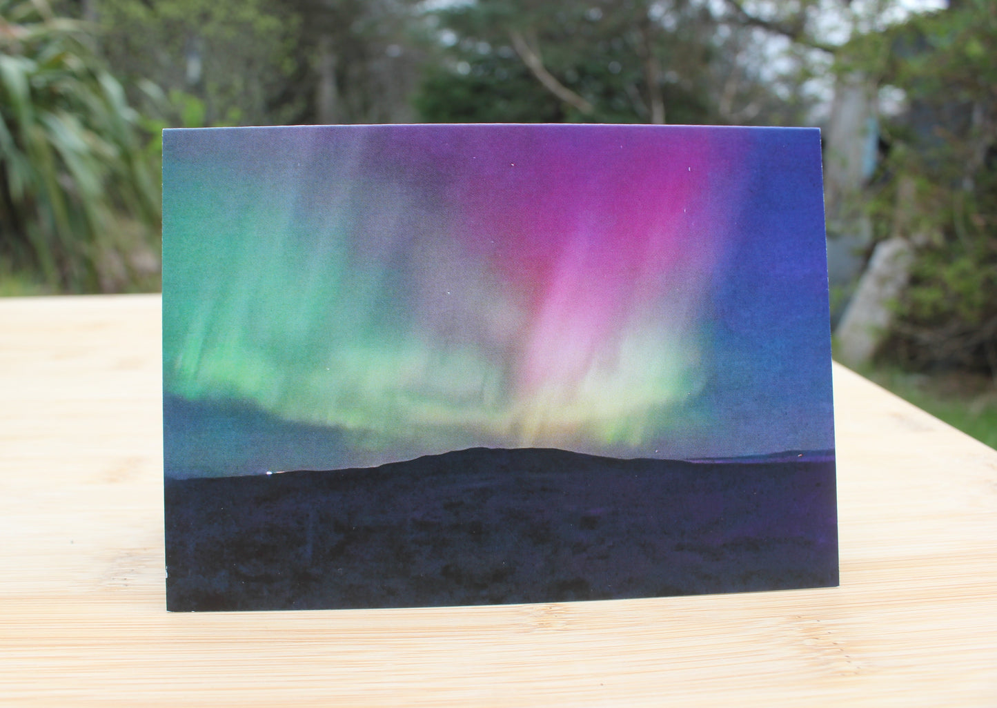 The northern lights on a January night, seen from the track to Achmore, Scottish Highlands. Showing the colours green, blue, turquoise, purple and an intense pink.