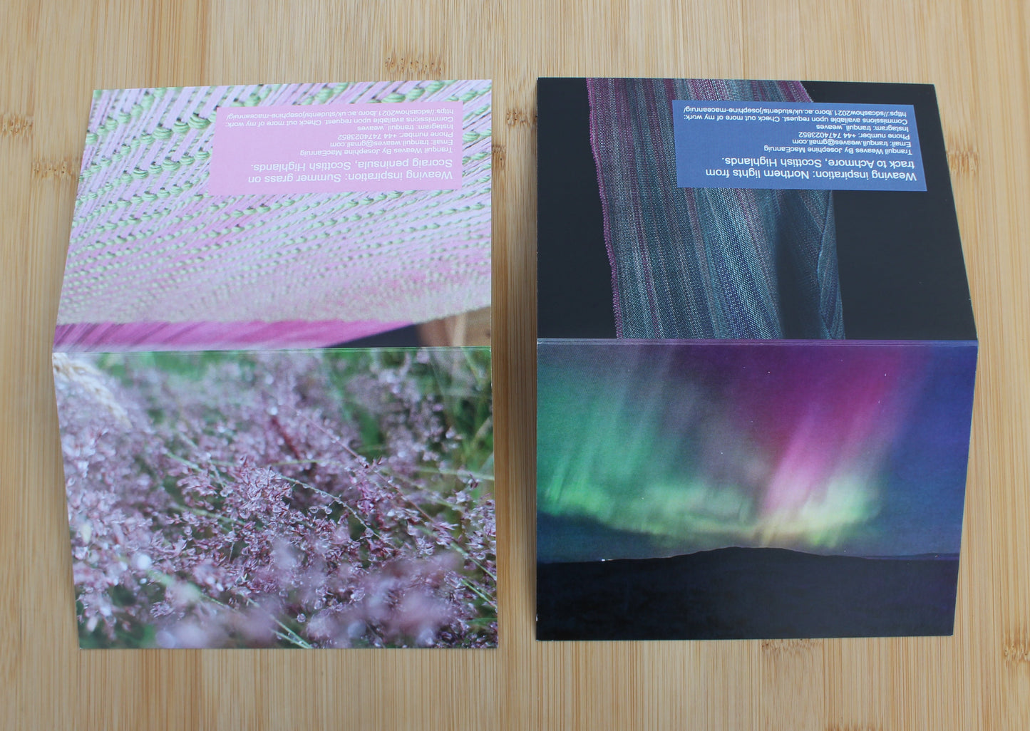 Showcasing the front and back of two cards. On the left the back of the dew dropped grasses card has a photo of a weaving that is green and pink. On the northern lights card has a weaving that gradients from turquoises and greens into a deep pink.